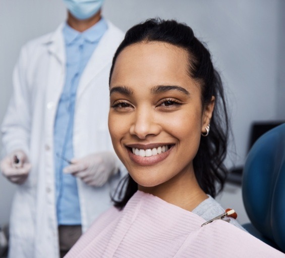 Woman smiling in dental chair in Windham dental office