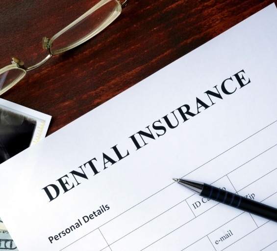 Dental insurance form on table