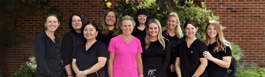 Dentist Windham ME Jenny Miedema is Posing Outside with Her Team About Us Jenny Miedema is Posing Outside with Her Team About Us