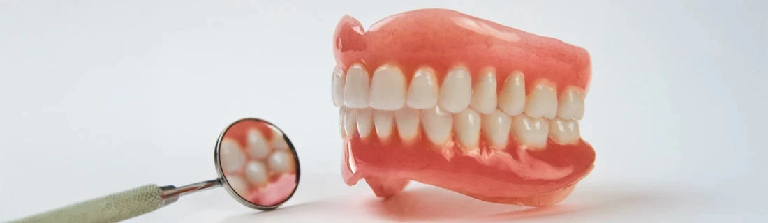 Dentist Windham ME Pair of Dentures on Display Against a White Backdrop For Missing Teeth Pair of Dentures on Display Against a White Backdrop For Missing Teeth